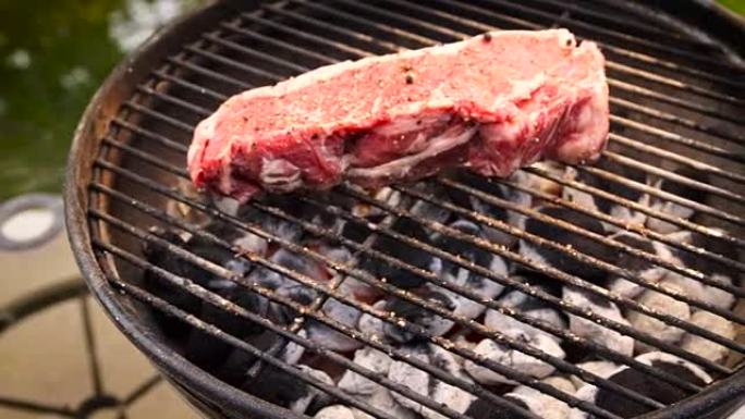 木炭烤架上的生牛肉牛排