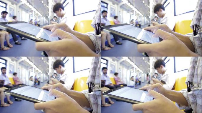 火车上人手打字虚拟键盘的特写