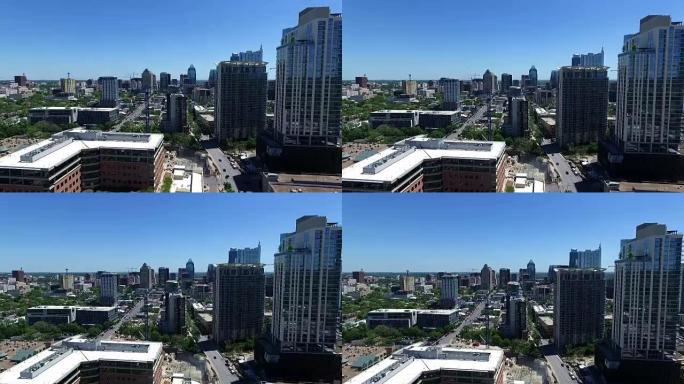 冉冉升起的空中奥斯汀在市中心的城市场景与新的建筑工地和建筑起重机清澈的蓝天奥斯汀德克萨斯