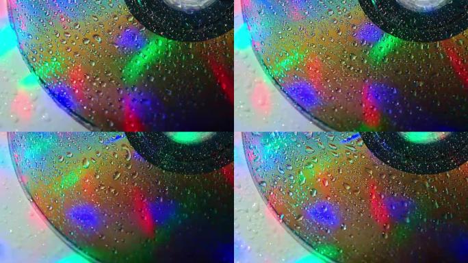 旋转DVD蓝光光盘，带水滴彩色灯光图案