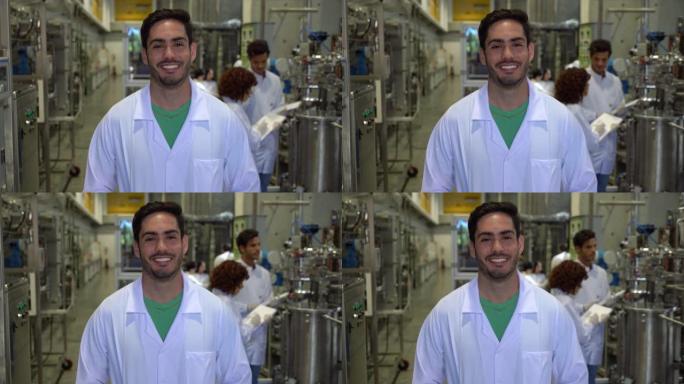 大学实验室里开朗英俊的男生面对镜头微笑