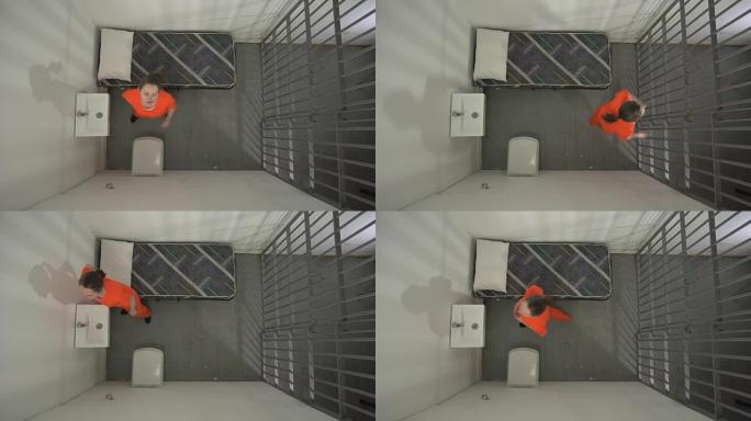 从上方4k: 监狱牢房中的女囚犯在地板上起搏