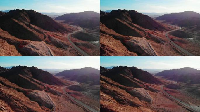 空中无人机拍摄了米德湖路 (通往内华达州拉斯维加斯的道路) 旁的红沙漠山脉