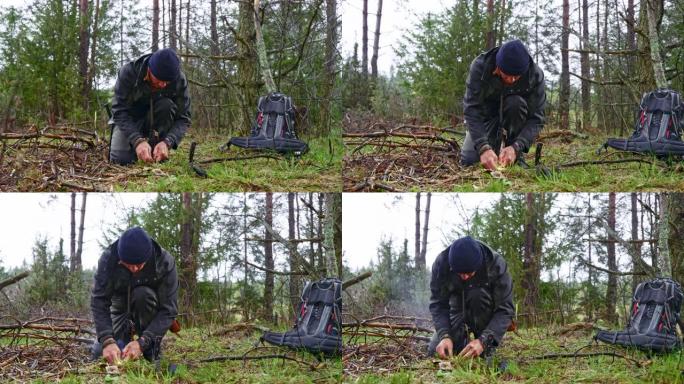 DS男性荒野生存专家在森林里生火