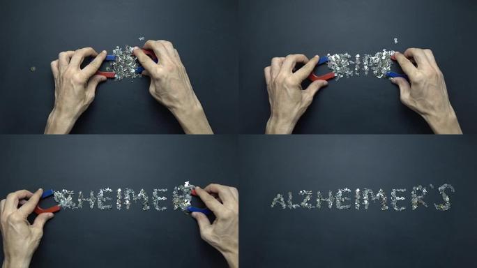 人手笔中的马蹄铁磁铁用黑板上的金属钟表书写阿尔茨海默氏症