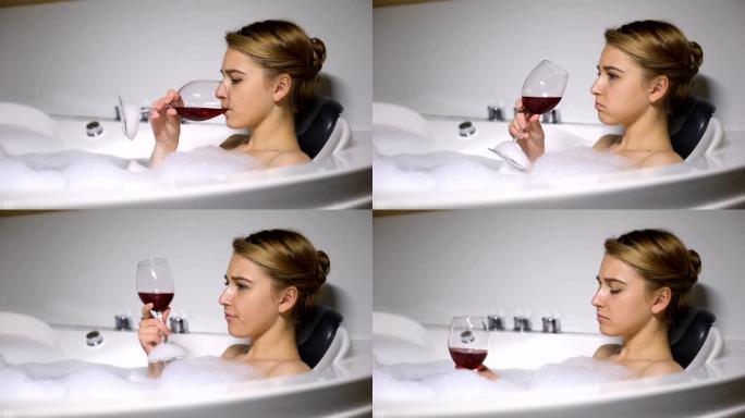 郁闷的女孩躺在浴缸里喝泡沫泡酒，男朋友分手