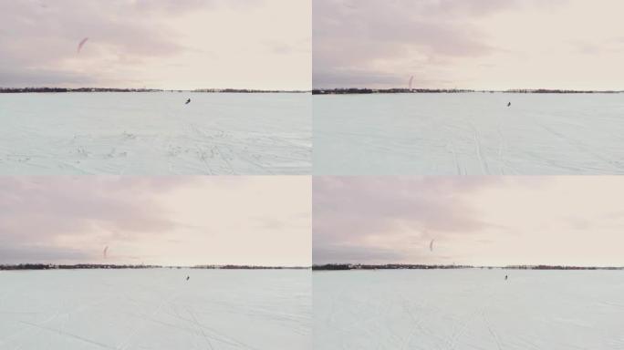 滑雪风筝上的男子拿着运动相机拍摄自拍照