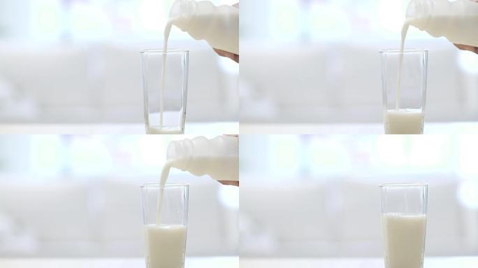倒一杯新鲜牛奶鲜奶玻璃杯倾倒