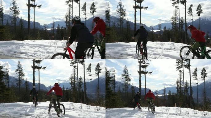 骑自行车的人穿越深雪到山景