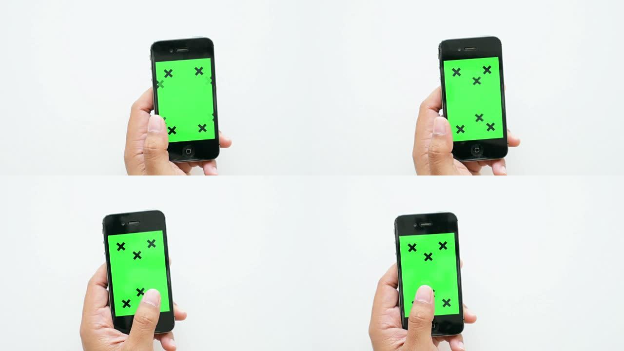 人们在白色背景上触摸智能手机绿屏，商业概念