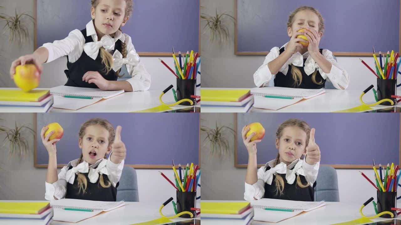 迷人的高加索女学生在练习本上写作，咬苹果，竖起大拇指。做作业的快乐女学生。教育理念，智力。电影院4k