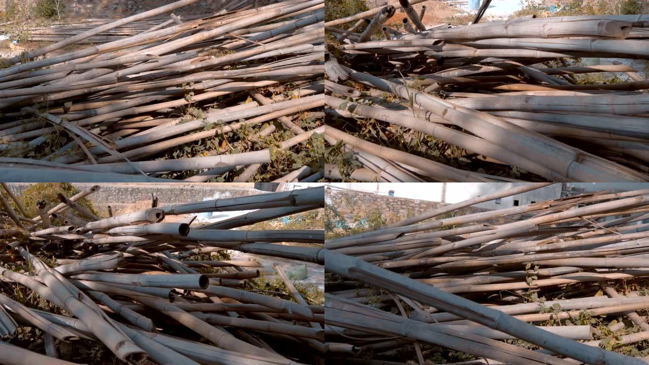 干燥的竹竿被粗心大意地倾倒在印度在建房屋附近