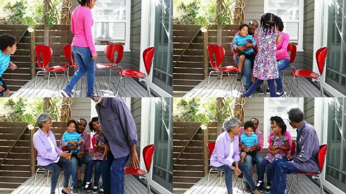 家庭团体一起坐在户外享受时光