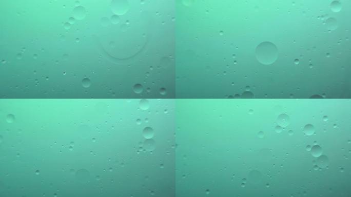 绿色背景上的油泡宏观摄影