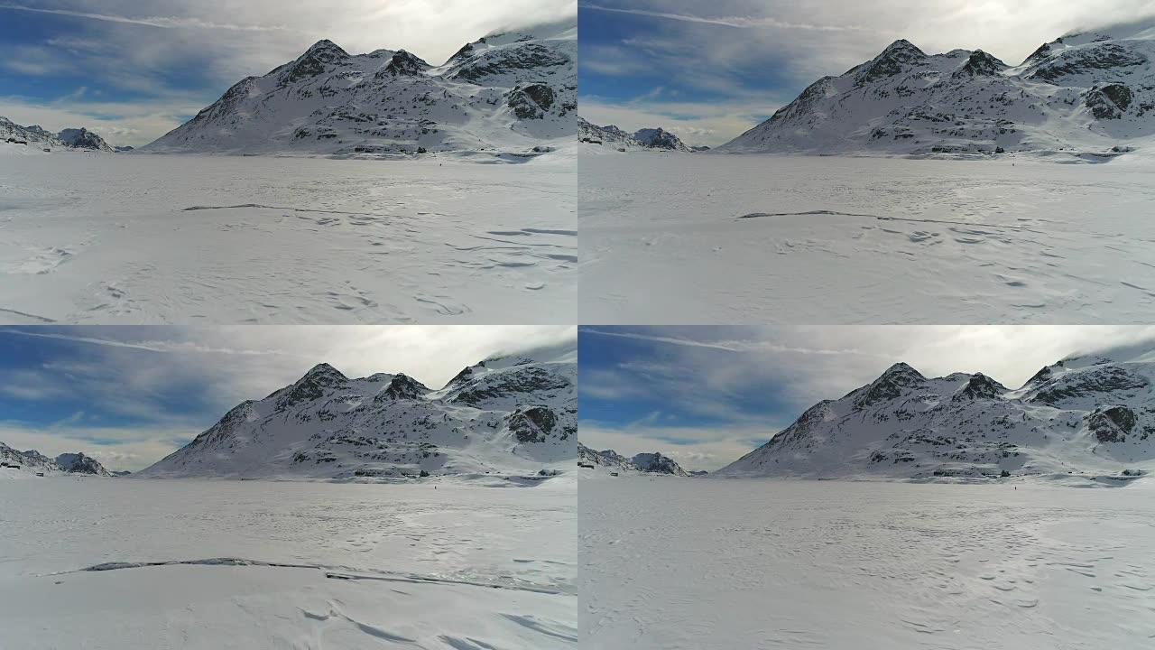 无人机飞越冰冻的山湖