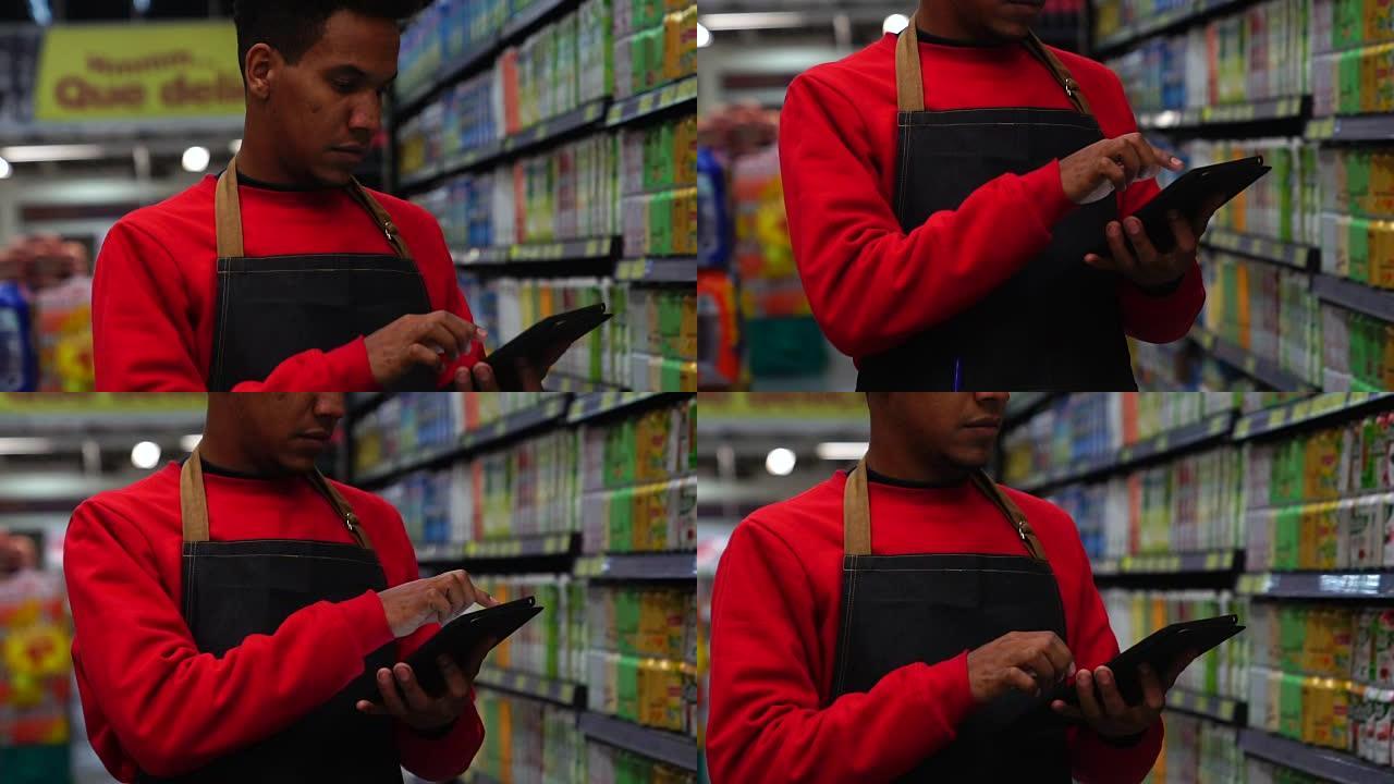 商人在超市的数字平板电脑中检查库存