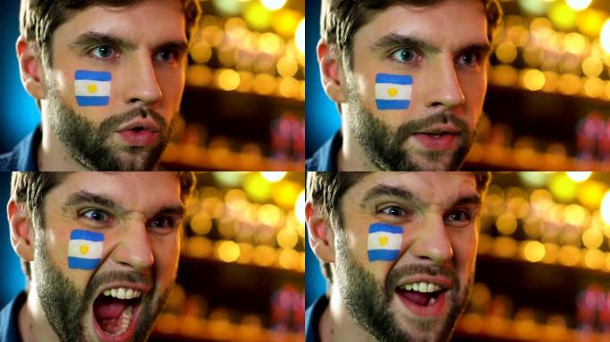 阿根廷足球迷在脸颊上举着旗子，为最喜欢的球队的胜利感到高兴