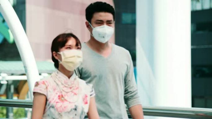 曼谷空气乳液: 年轻夫妇患有面罩保护咳嗽