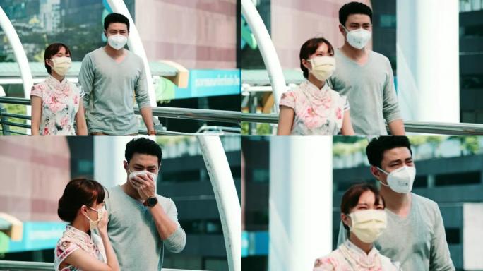 曼谷空气乳液: 年轻夫妇患有面罩保护咳嗽