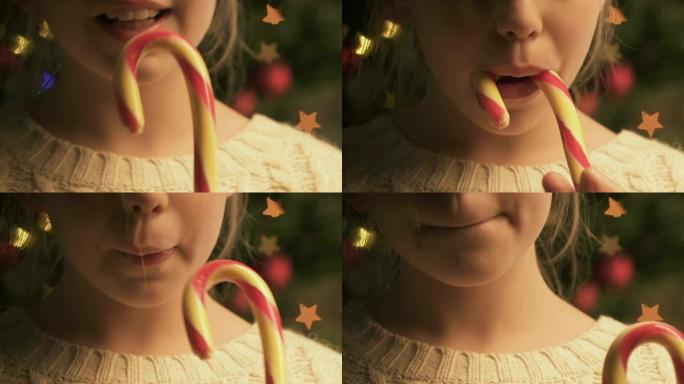 小女孩舔糖果棒，喜欢美味的圣诞甜点