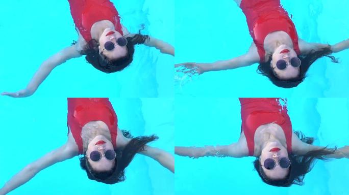 美女躺在水面，暑假在泳池里放松