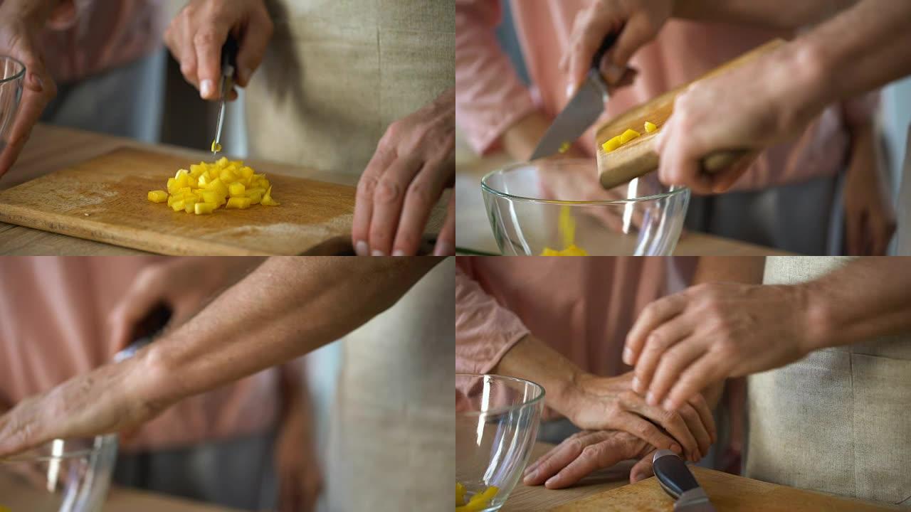 有爱心的丈夫煮新鲜蔬菜沙拉，妻子轻轻抚摸他的手