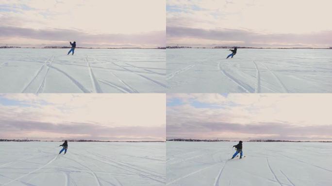 风筝冲浪者被他的风筝拖着穿过雪地