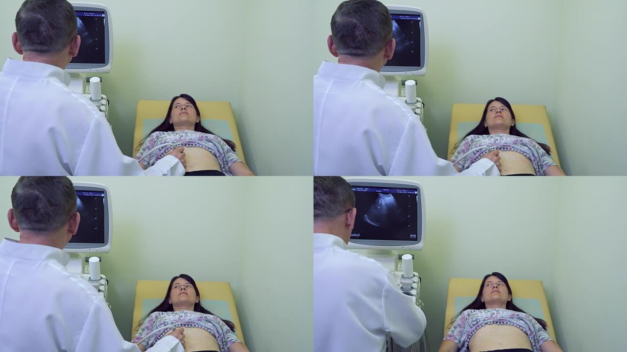 医生用超声设备检查孕妇的腹部
