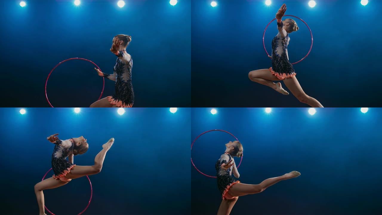SLO MO LD艺术体操运动员在旋转篮筐时表演雄鹿跳跃