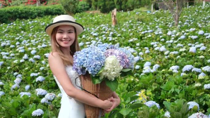 4k慢动作泰国美女游客她去了绣球花场。新鲜空气，她很开心