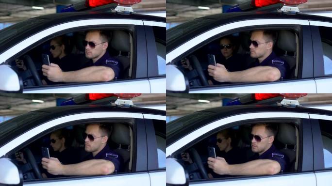 严肃的警察使用手机app监控交通事故