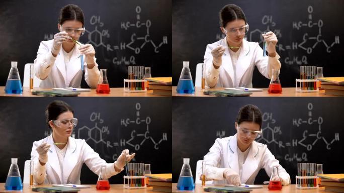 化学学生在试管中滴液和书写结果，实验