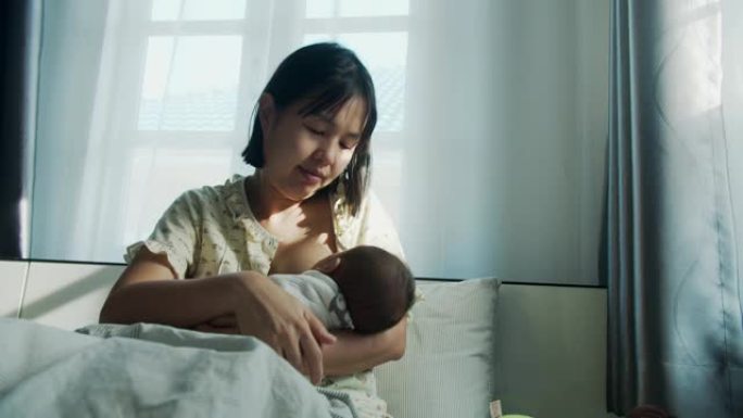 母亲母乳喂养她的小男孩