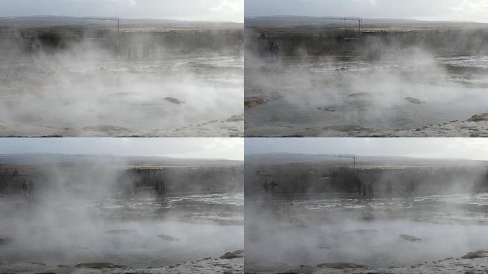 Panningshot: 冰岛Strokkur间歇泉的游客