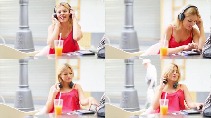 在夏日里，金发女人在酒吧工作和阅读