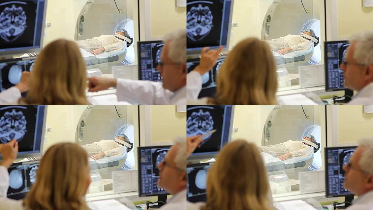 医生在CAT扫描机上与病人交谈