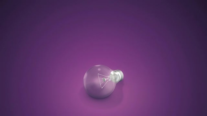 紫色背景上的灯泡紫色背景上灯泡闪烁