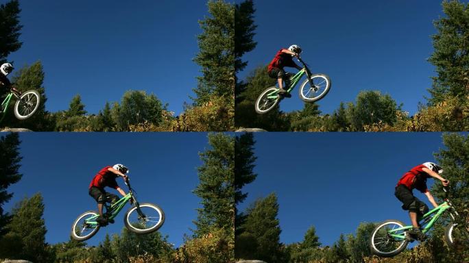 山地自行车手在空中飞行，慢动作