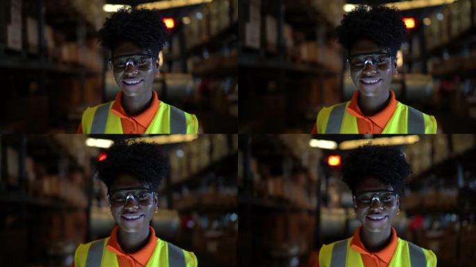 仓库里非洲微笑的年轻工人的肖像