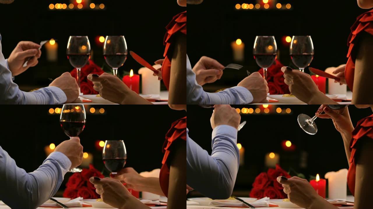 优雅的情侣在餐厅用餐，碰杯庆祝情人节