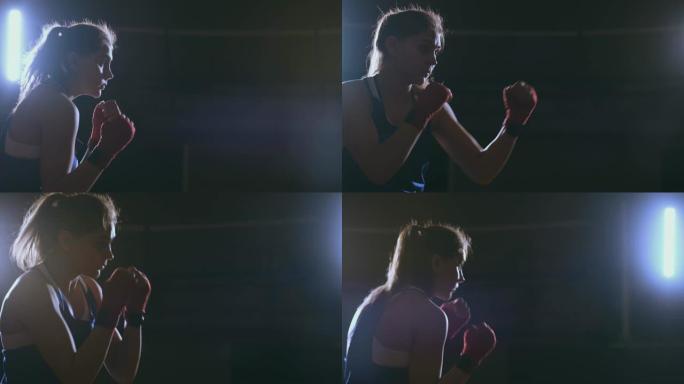 在黑暗的房间里训练一个漂亮的女拳击手。斯蒂安卡姆开枪。备战自卫战环