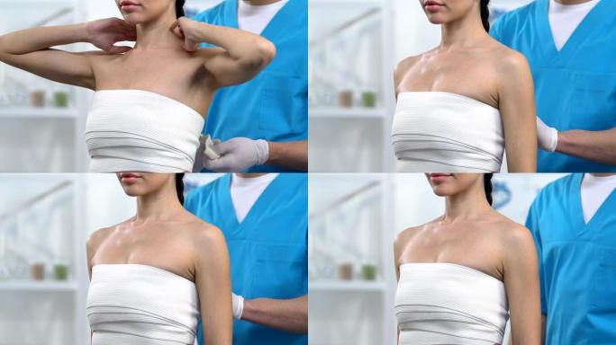男性医生在女性患者胸部包裹弹性贴合乳房，骨创伤