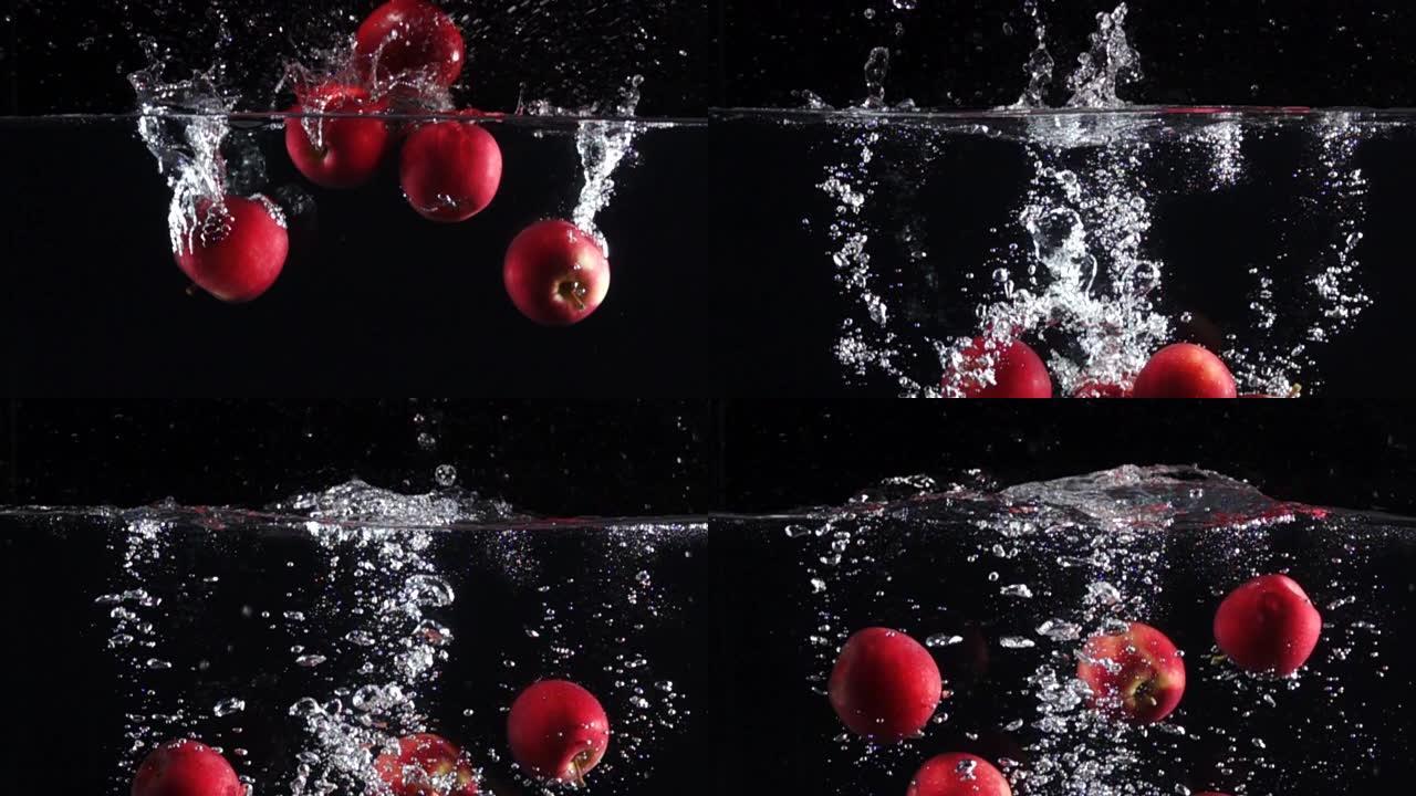 超级慢动作: 苹果掉入黑色背景下的淡水中