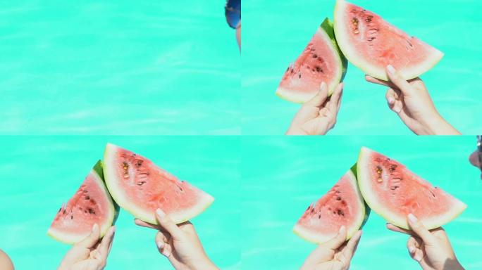 女人在游泳池旁碰着西瓜片，玩得开心，维生素水果
