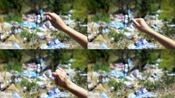女人把烟头扔进森林垃圾填埋场，人类对生态系统的影响