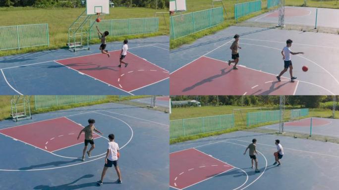 两个年轻朋友在室外球场打篮球