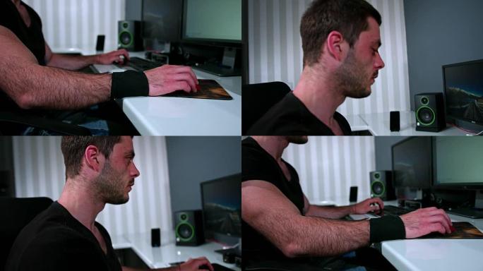 手持特写慢动作拍摄一个用电脑工作的帅哥