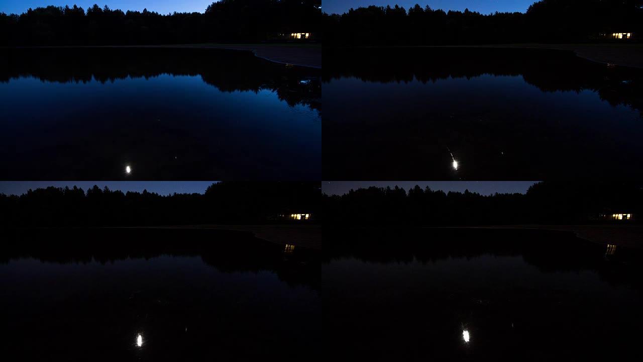 静止的湖上的星星和月亮的短暂时光流逝