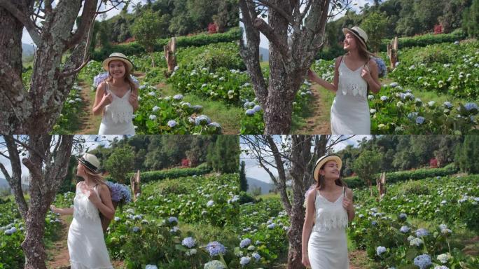 4k慢动作泰国美女游客她去了绣球花场。新鲜空气，她很开心
