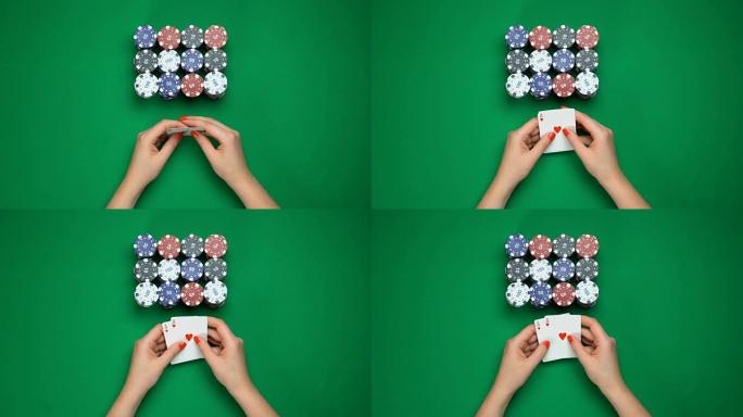扑克玩家握着强壮的手，一对王牌，成功的游戏，顶视图
